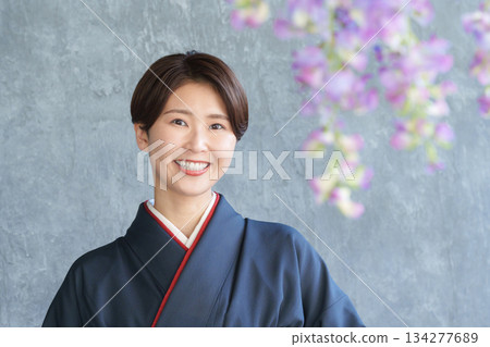 A smiling woman in a kimono A smiling woman in a kimono 134277689