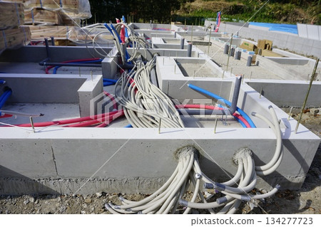 Foundation work for water supply pipes and drainage pipes in the foundations of apartment buildings Foundation work for water supply pipes and drainage pipes in the foundations of apartment buildings 134277723