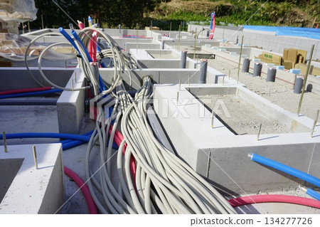 Foundation work for water supply pipes and drainage pipes in the foundations of apartment buildings Foundation work for water supply pipes and drainage pipes in the foundations of apartment buildings 134277726