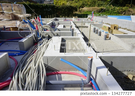 Foundation work for water supply pipes and drainage pipes in the foundations of apartment buildings Foundation work for water supply pipes and drainage pipes in the foundations of apartment buildings 134277727