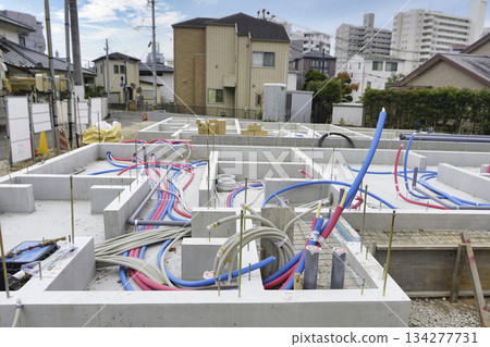 Foundation work for water supply pipes and drainage pipes in the foundations of apartment buildings Foundation work for water supply pipes and drainage pipes in the foundations of apartment buildings 134277731