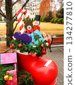 Christmas presents on the street corner, red boots 134277810