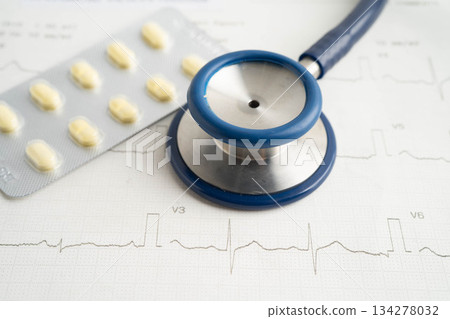 Stethoscope on electrocardiogram ECG with drug, heart wave, heart attack, cardiogram report. 134278032