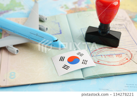 South Korea passport with approved stamp on document for tourism. 134278221