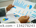 Asian business woman working with financial graph. 134278243