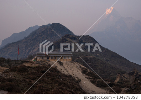 Mt.Machapuchare (6,993 m) the sacred mountains covered by air pollution seen from Mardi Himal high camp in Nepal. 134278358