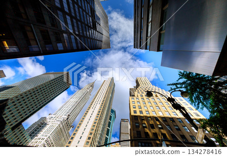 Looking up at Manhattan tower tall buildings in New York City area 134278416