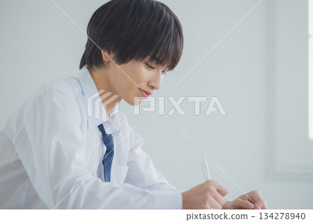 Male high school student studying 134278940