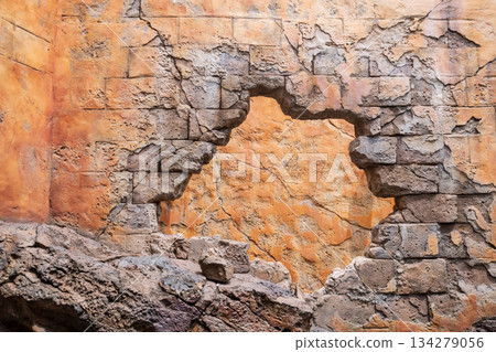Prison break by wrecking brick wall. Escape and flee concept Prison break by wrecking brick wall. Escape and flee concept 134279056