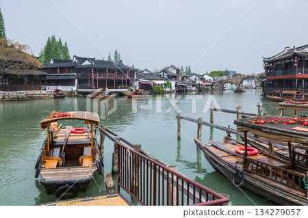 Tourist punting boat at port by Fangsheng Bridge, Zhujiajiao town 134279057