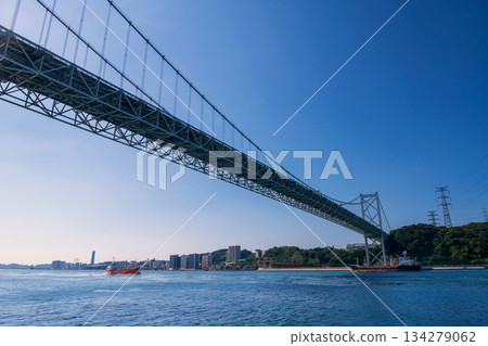 cargo ships pass through Kanmon Bridge, Kitakyushu, Fukuoka 134279062