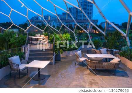 Open air roof top restaurant at night in Bangkok, Thailand. 134279063