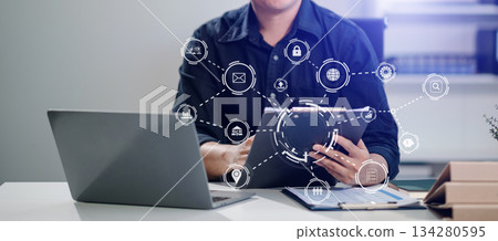 Business report, analysis and planning, Business hand pointing at business document and a tablet, smartphone Business report, analysis and planning, Business hand pointing at business document and a tablet, smartphone 134280595