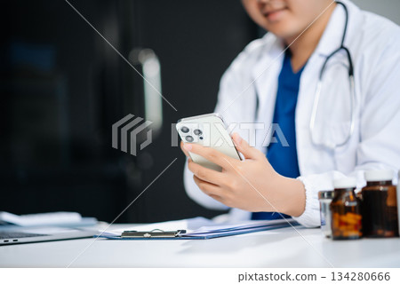Medical technology concept. Doctor working with mobile phone and stethoscope Medical technology concept. Doctor working with mobile phone and stethoscope 134280666