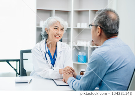 Asian female hands touching old female hand Helping hands take care of the elderly concept in hospital 134281148