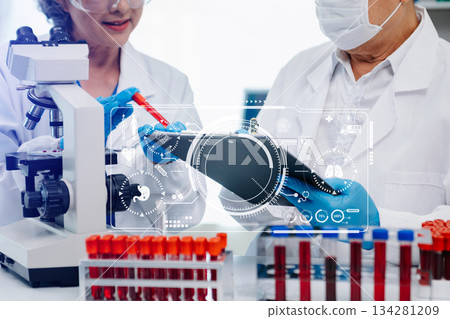 Scientist team meeting and writing analysis results in the laboratory study Scientist team meeting and writing analysis results in the laboratory study 134281209