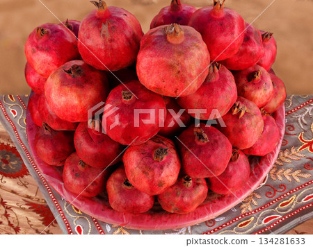 pomegranate on a wooden background pomegranate on a wooden background 134281633