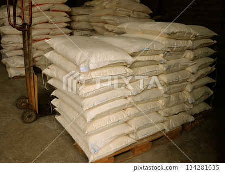 sacks of flour in a warehouse sacks of flour in a warehouse 134281635