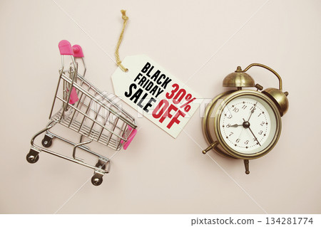 Black Friday Sale 30% off Limited time offer text with trolley shopping cart and alarm clock on pink background Black Friday Sale 30% off Limited time offer text with trolley shopping cart and alarm clock on pink background 134281774