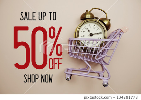 Sale 50% off text with alarm clock and trolley shopping cart on pink background Sale 50% off text with alarm clock and trolley shopping cart on pink background 134281778
