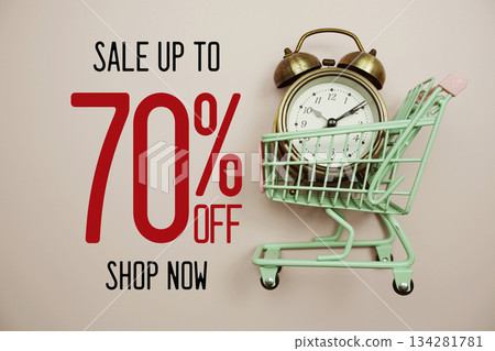 Sale 70% off Shop Now text with alarm clock and trolley shopping cart on pink background 134281781