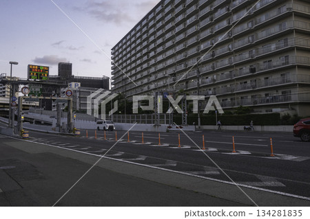 A view of a huge apartment complex, roads, and a highway entrance A view of a huge apartment complex, roads, and a highway entrance 134281835