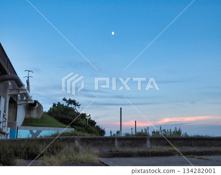 Winter sunset landscape with sky, moon and river Winter sunset landscape with sky, moon and river 134282001