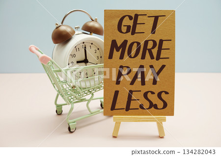 Get More Pay Less with Shopping Cart and Alarm Clock on Pastel Background Get More Pay Less with Shopping Cart and Alarm Clock on Pastel Background 134282043