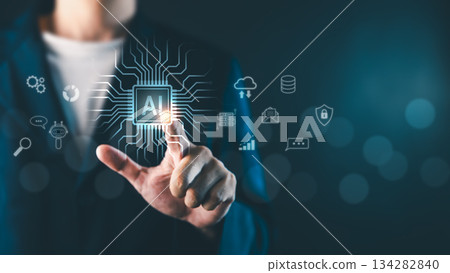A businessman touching a glowing AI chip icon with digital network symbols, representing artificial intelligence, technology integration, and innovation in a virtual environment 134282840