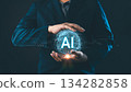AI artificial intelligence futuristic technology concept, Businessman holding a glowing digital globe with AI text, innovation smart business, data analytics, and global digital transformation 134282858