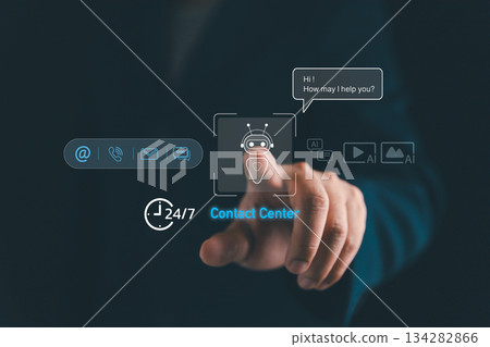 Futuristic AI chatbot concept with a human hand touching digital contact center icons, 24 hours a day and 7 days a week customer support, artificial intelligence technology and communication service 134282866