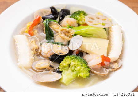 Delicious Chinese food, stir-fried vegetables and seafood with salt Delicious Chinese food, stir-fried vegetables and seafood with salt 134283051