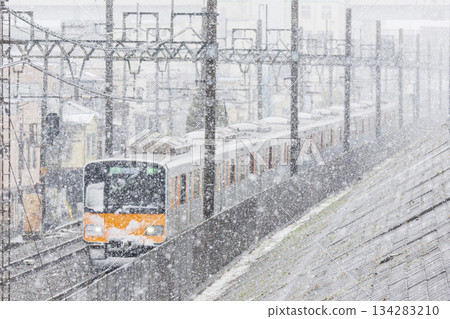 Commuter train (Tobu 50050 series) running through snowy Tokyo Commuter train (Tobu 50050 series) running through snowy Tokyo 134283210