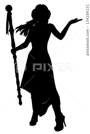 Silhouette of a Sorceress Holding a Magic Staff 134284131