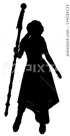 Silhouette of a Sorceress Holding a Magic Staff 134284133