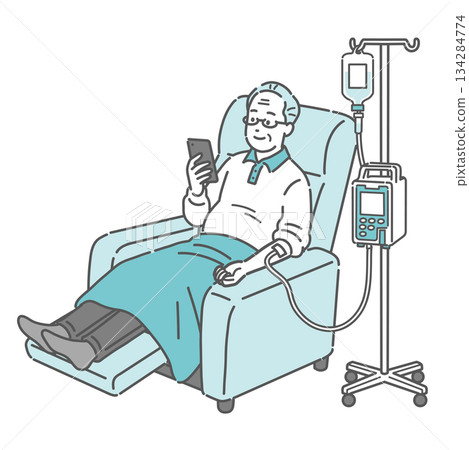 Elderly man looking at smartphone while receiving intravenous drip in a reclining chair (dialysis, chemotherapy, infusion pump) 134284774