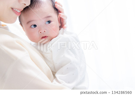 Cuddled baby 134286560