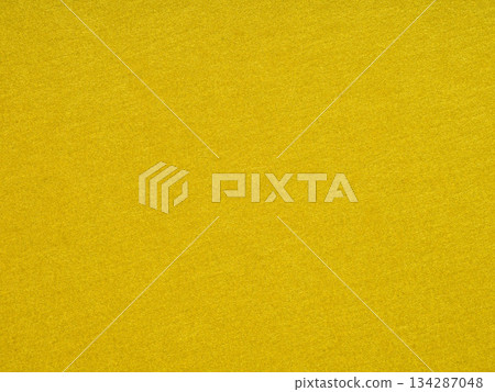 A vibrant yellow hue saturates the textured surface, conveying warmth, happiness, and creative inspiration A vibrant yellow hue saturates the textured surface, conveying warmth, happiness, and creative inspiration 134287048