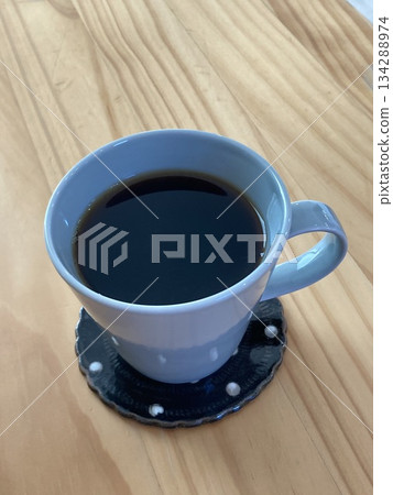 Black coffee in a mug (taking a break at a cafe) Black coffee in a mug (taking a break at a cafe) 134288974