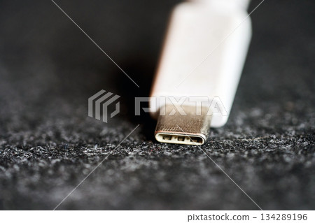 Close view of a white USB-C connector Close view of a white USB-C connector 134289196