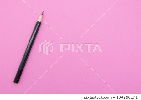 Black pencils on a light pink background. Stationery, study, design image. 134290171