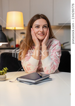 Adult woman freelancer at night seeks idea inspiration thinks plans weekend creative focus calm hope 134290776