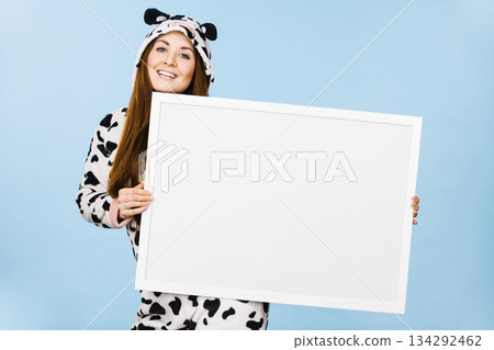 Funny girl with blank empty banner board. 134292462