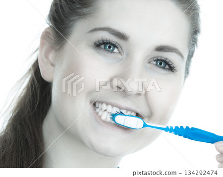 Woman brushing cleaning teeth. Woman brushing cleaning teeth. 134292474