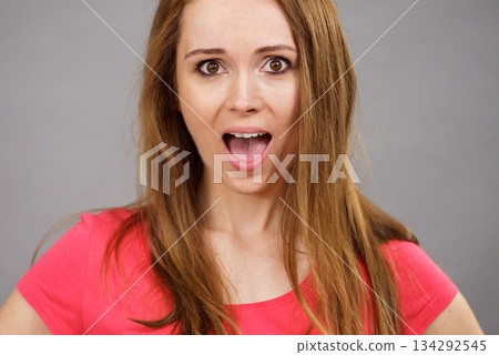 Shocked and surprised woman 134292545