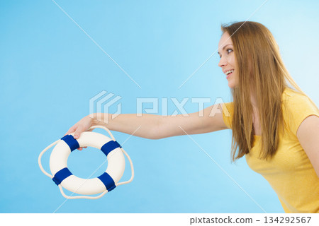 Girl holds life buoy rescue ring Girl holds life buoy rescue ring 134292567