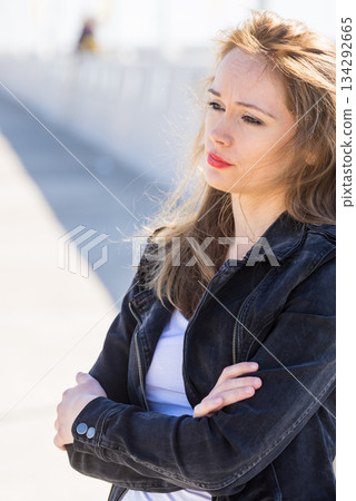 Sad woman walking outdoor 134292665
