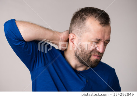 Man having neck ache Man having neck ache 134292849