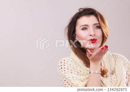 Young woman blowing kiss. Young woman blowing kiss. 134292973