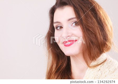 Smiling woman wearing scarf. Smiling woman wearing scarf. 134292974